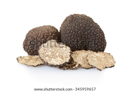 Black truffles group and slices isolated on white, clipping path included Royalty-Free Stock Photo #345959657