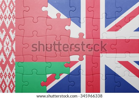 puzzle with the national flag of great britain and belarus . concept