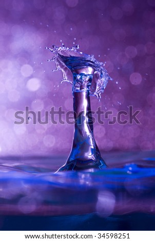 Brightly colored capture of a water drop collision