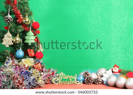 Christmas decorations on the wooden floor of red on a green background.