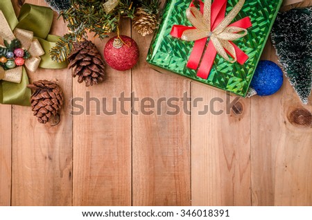 Christmas background with decorations on wooden panel