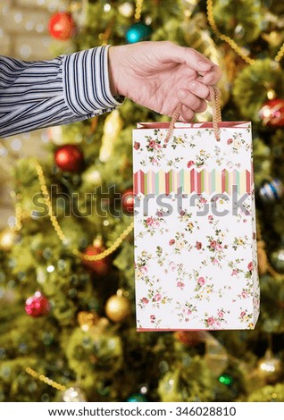 Christmas gift. man gives a New Year's gift