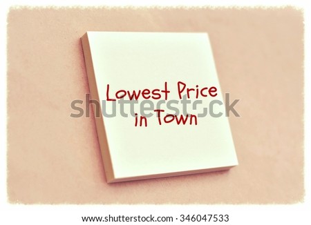 Text lowest price in town on the short note texture background