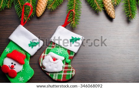 Christmas card, Christmas ornaments, socks and toys on wooden background, horizontal photo