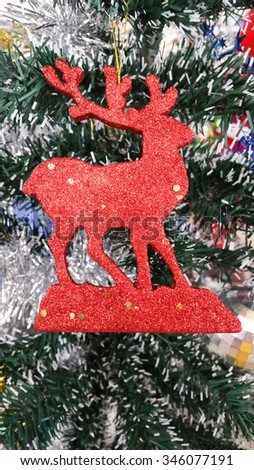 Reindeer on Christmas trees .