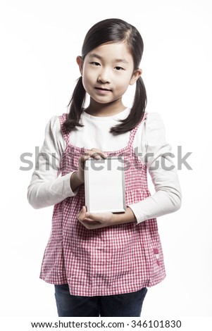 A asian(korean, japanese, chinese) girl(kid, student, child, woman, female) wearing pink skirt and denim pants stand up with a wood photo frame for friend and family isolated white.