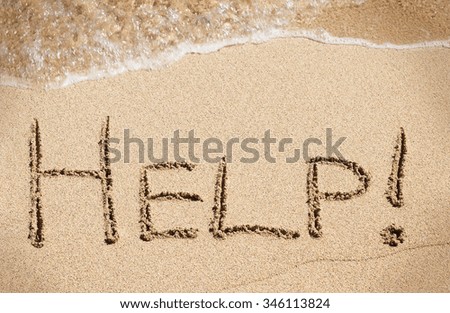 Help handwritten on sand of beach with wave on background