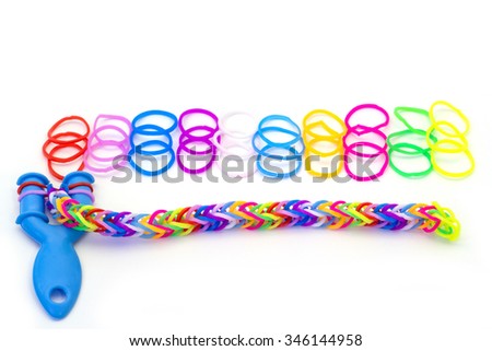 Rainbow loom Colored rubber bands for weaving accessories on a white background