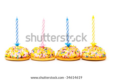 Cup cakes and candle isolated on the white background