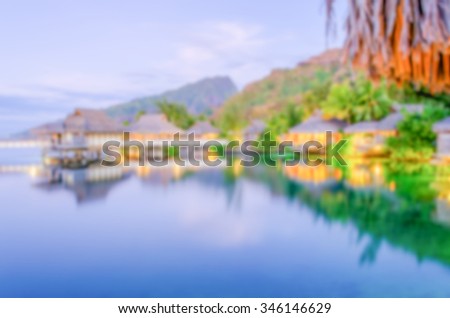 Defocused background with Overwater Bungalows in French Polynesia. Intentionally blurred post production for bokeh effect