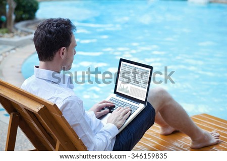 stock market online, business man working with financial data online on laptop near swimming pool