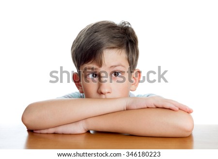 A boy with strabismus, isolated on white background Royalty-Free Stock Photo #346180223