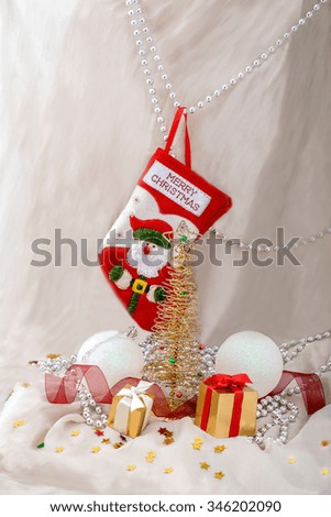 Celebration theme with gift, balls and Christmas  metallic fir with red stock
