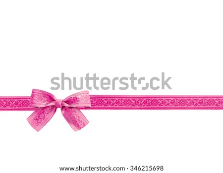 beautiful pink bow with ribbon - isolated on white background