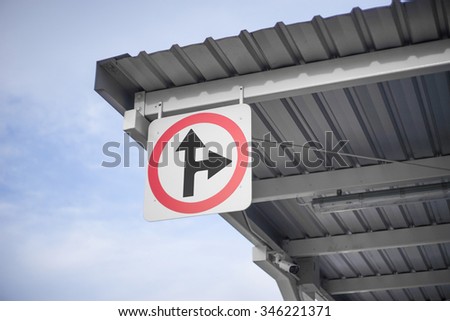 Traffic signs or road signs on the roof with sky background