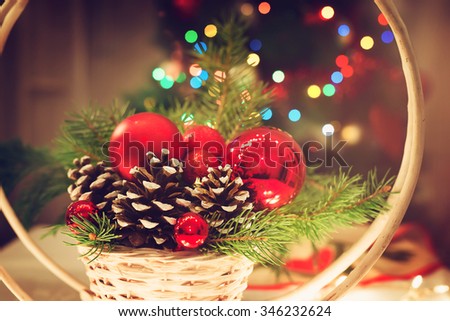 Christmas decoration. Christmas bubbles and pinecone. Shallow depth of field.
