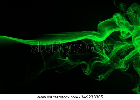 Green smoke abstract on dark background