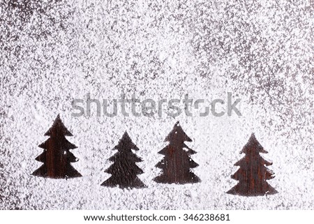 Christmas tree wooden background with snow
