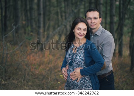 Pregnancy, maternity and  family picture in outdoors, late November