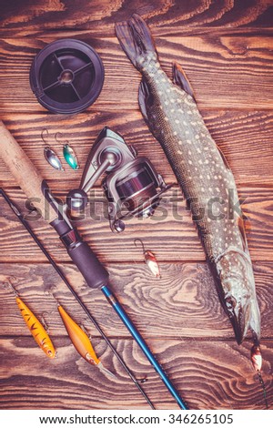 set of fishing tackle on a wooden table