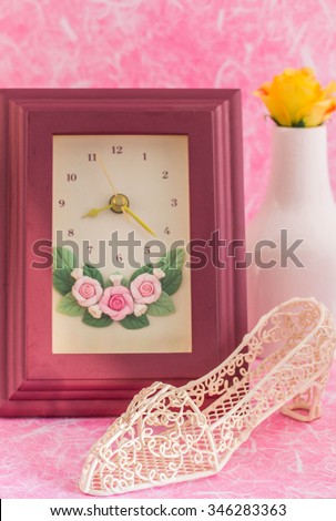 Shoes and picture frames on the pink background.