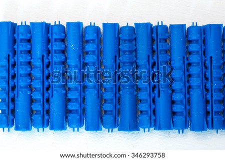 Plastic plugs arranged in a row