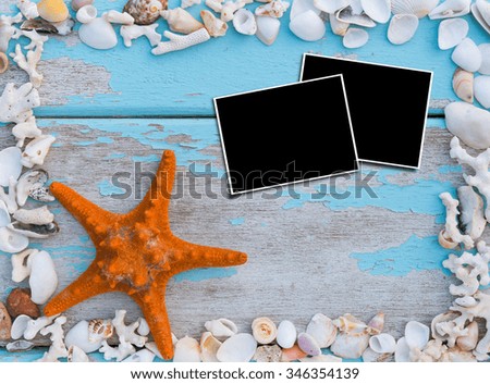 Picture frames,starfish and sea shells border on grunge wood background,top view