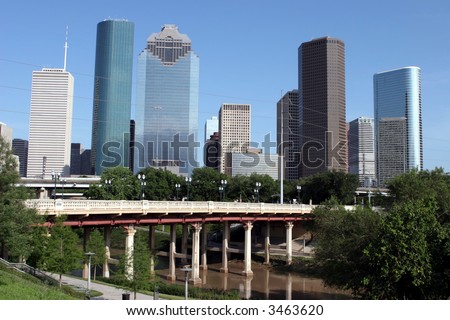View of Downtown Houston and Buffalo Bayou bridge from a park