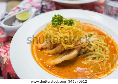 Curried Noodle Soup (Khao soi) with coconut milk, Traditional of Northern Thai cuisine.