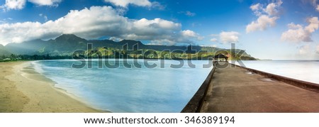 High definition stitched panorama of Hanalei Bay and pier at dawn with the Na Pali coast in the background near Hanalei, Kauai, Hawaii