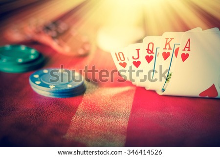 Heavenly light illuminates a winning hand in this poker background photo Royalty-Free Stock Photo #346414526