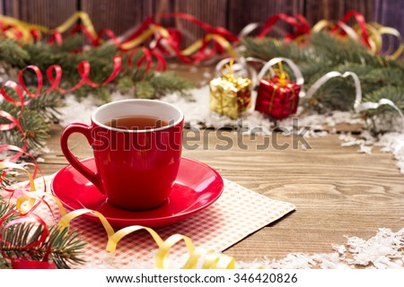 Christmas garlands of red cup on the table