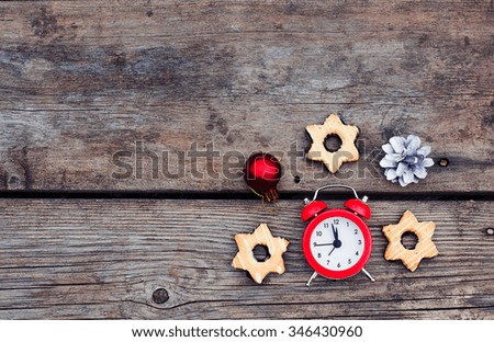 Christmas background with clock on a wooden background 