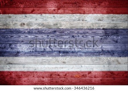 A vignetted background image of the flag of Thailand onto wooden boards of a wall or floor.