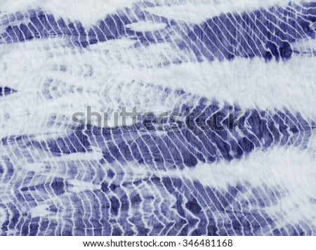 tie dyed pattern on cotton fabric background.
