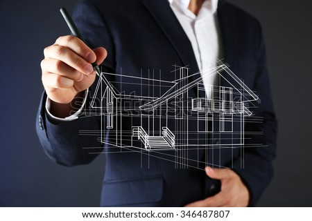 Real estate offer. Businessman drawing a model of the house