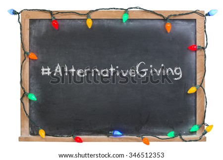 Alternative Giving written in white chalk on a black chalkboard surrounded with colorful lights isolated on white