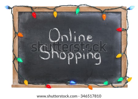Online Shopping written in white chalk on a black chalkboard surrounded with colorful lights isolated on white