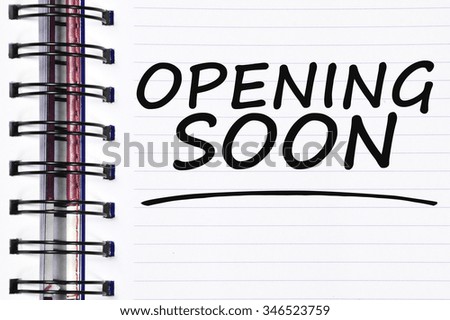 opening soon words on spring white note book.
