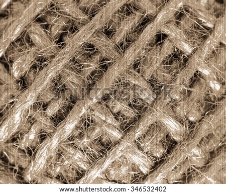 The texture of diagonal filaments can be used as a background. Old style. Sepia