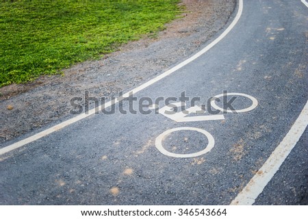 Bicycle sign on bicycle lane, in the garden