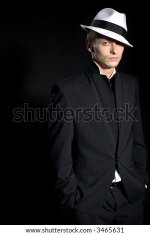 man in black suite and white hat