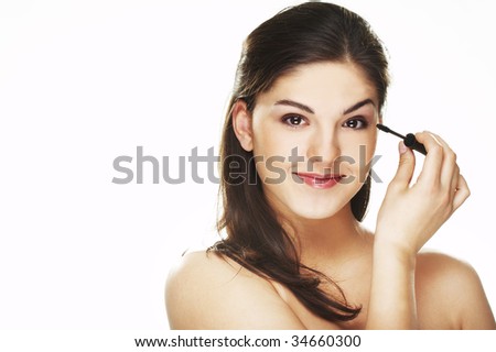 Pretty woman applying make up
