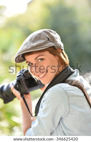 Portrait of cheerful young photographer