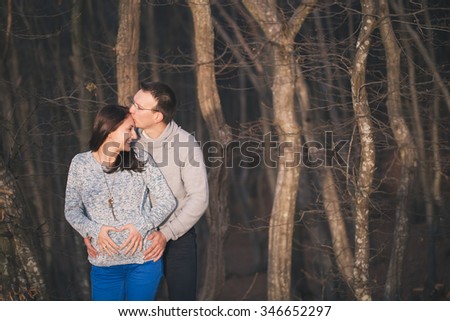 Pregnancy, maternity and family picture in outdoors, late November