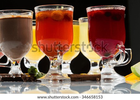 mulled wine. fruit or berry drink. alcohol winter. against a dark background