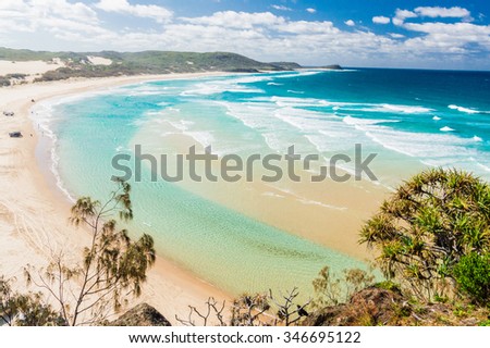 The incredible stretch of Fraser Island's sandy beach Royalty-Free Stock Photo #346695122