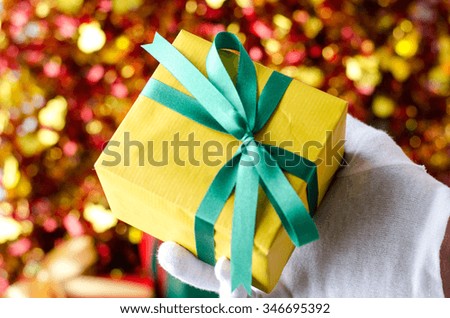 Santa Claus Showing a Christmas Gift Box