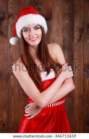 Portrait of santa girl crossed arms isolate