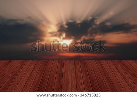 Empty wooden table and beautiful summer sunset in background. Great for product display montages
